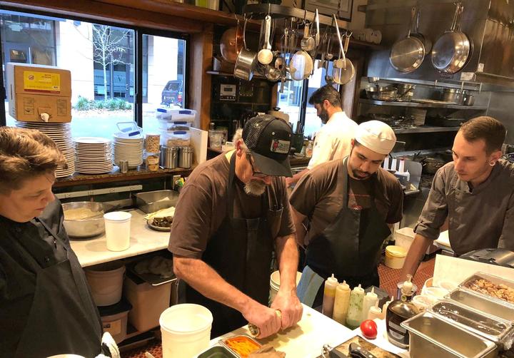 Mr. Higgins with staff in kitchen.jpeg