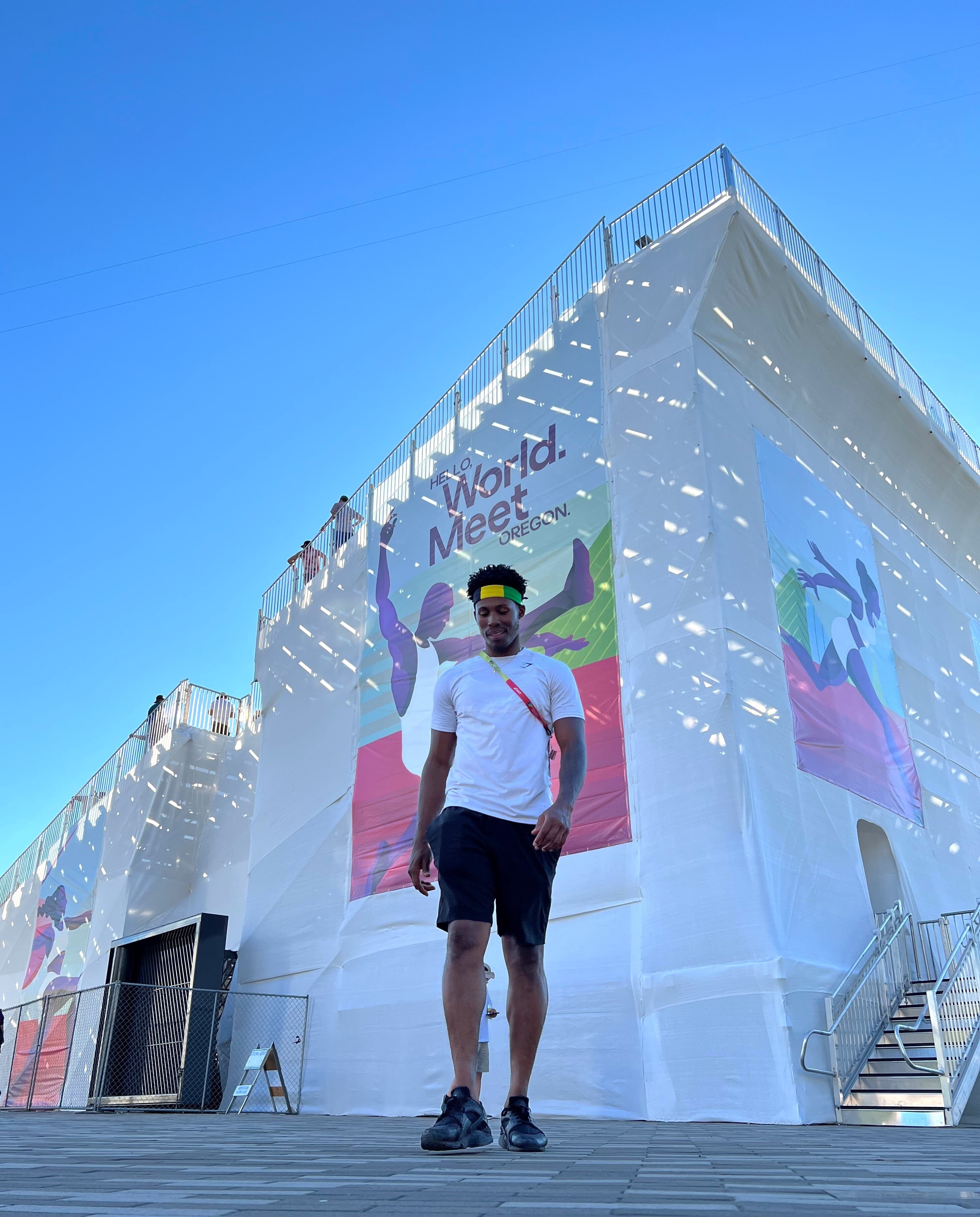 Oraine front of World Meet Banner.jpg