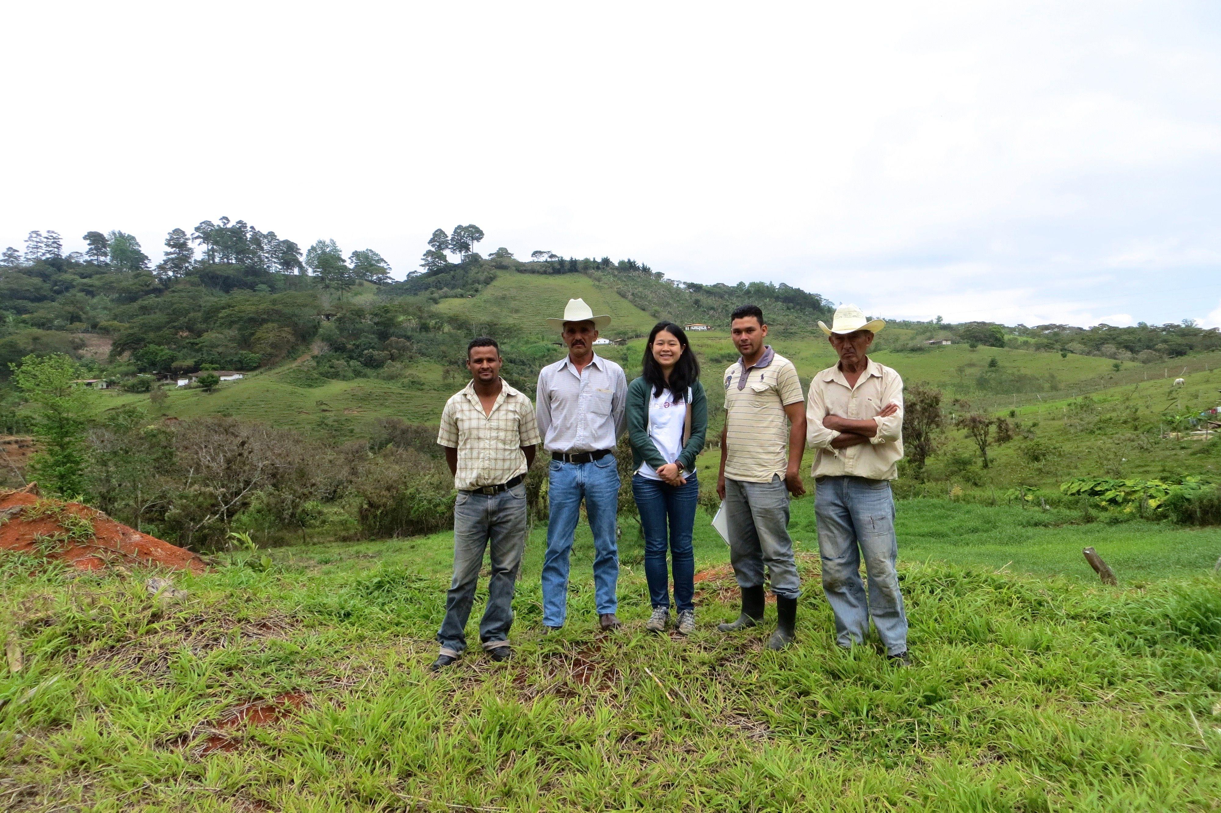 ACE Coffee Erin with farmers in Honduras.jpeg